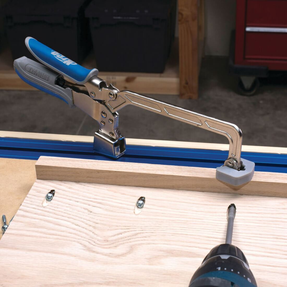 Kreg Automaxx 6 inch Bench Clamp shown in bench rail clamping a wooden frame