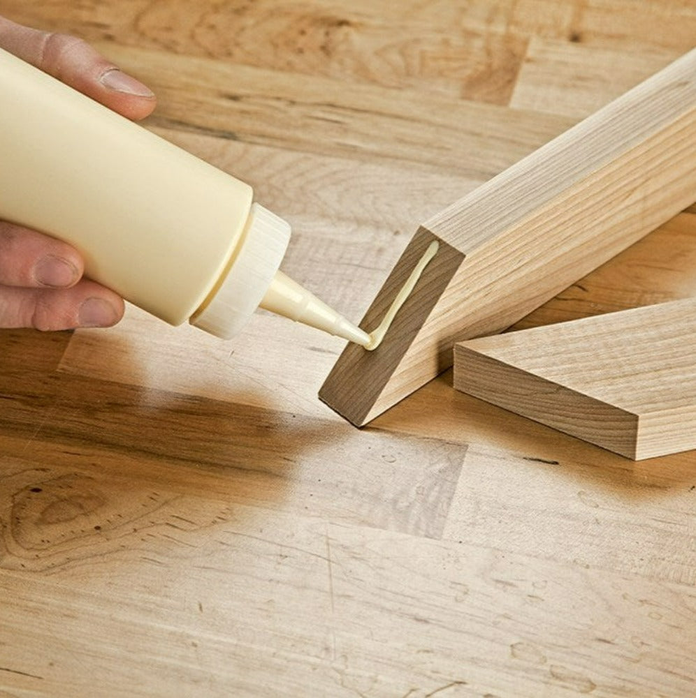 Rockler Glue Bottle with Standard Spout shown applying a line of glue to ends of woods lengths.