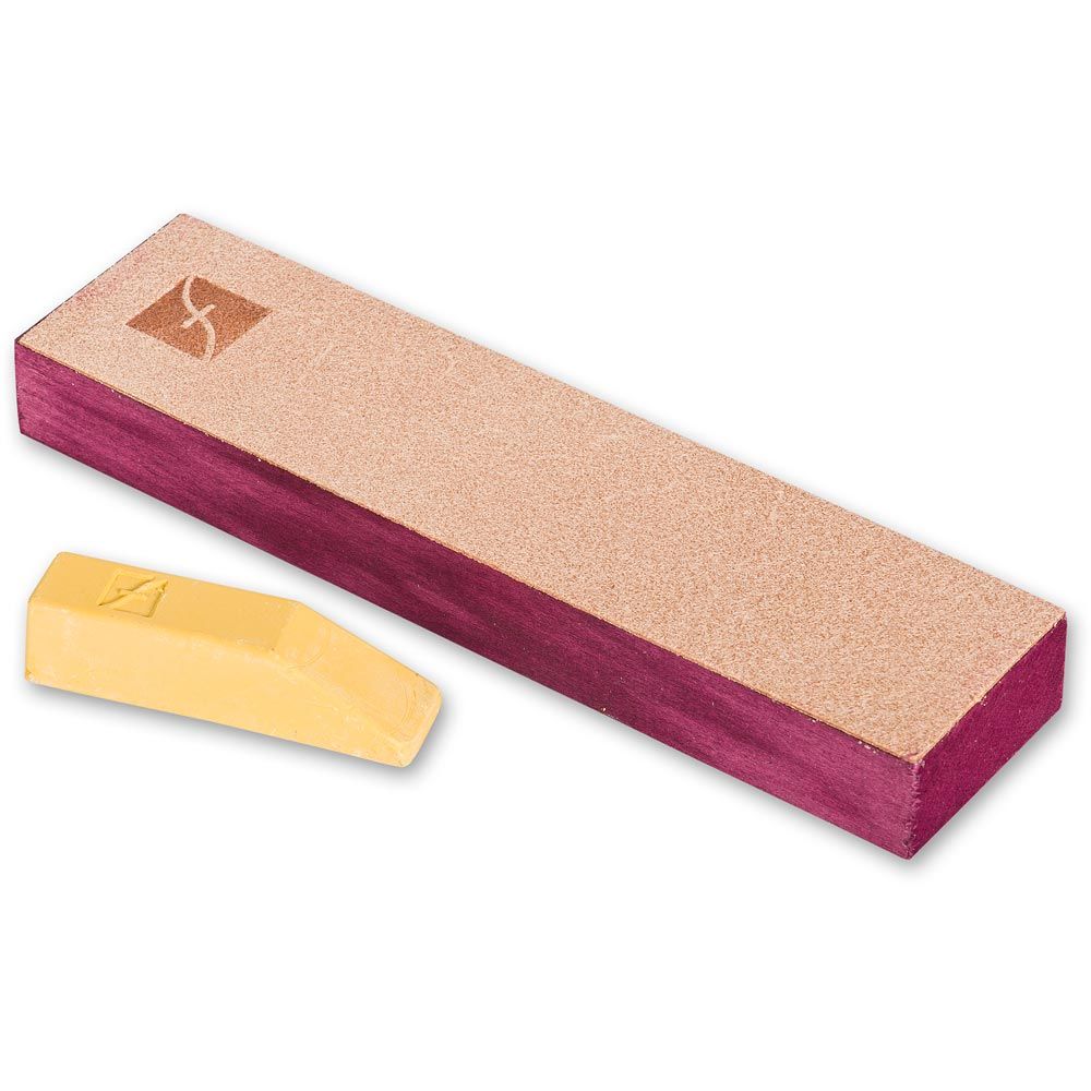 image of the Flexcut PW14 leather slipstrop on a block. The gold compound wax is included.