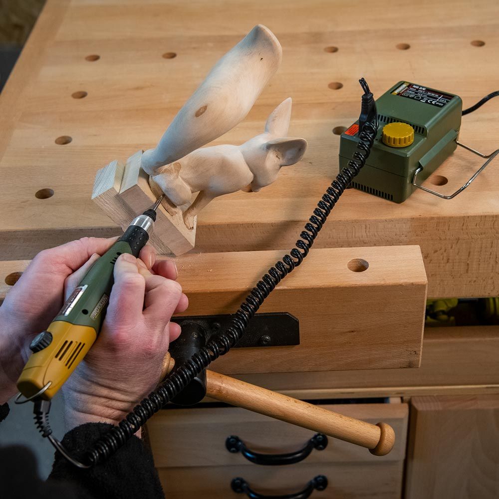 picture showing the carving abilities of the Proxxon Micromot 60/EF Mill/Drill Unit carving a wood carved squirrel. Unit is connected to the 12v transformer