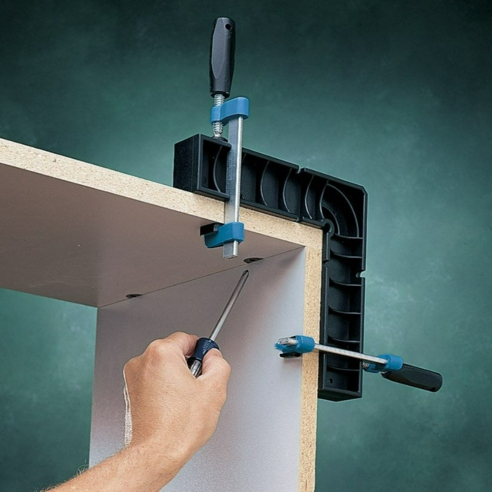 Rockler Clamp-it Bar clamp shown as used with Rockler clamping square to clamp a corner of a cabinet to aid assembly.