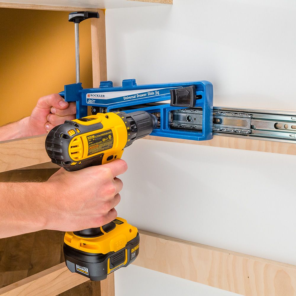 Rockler Universal Drawer Slide Jig used to hold runner in place while screwing runner to inside cabinet