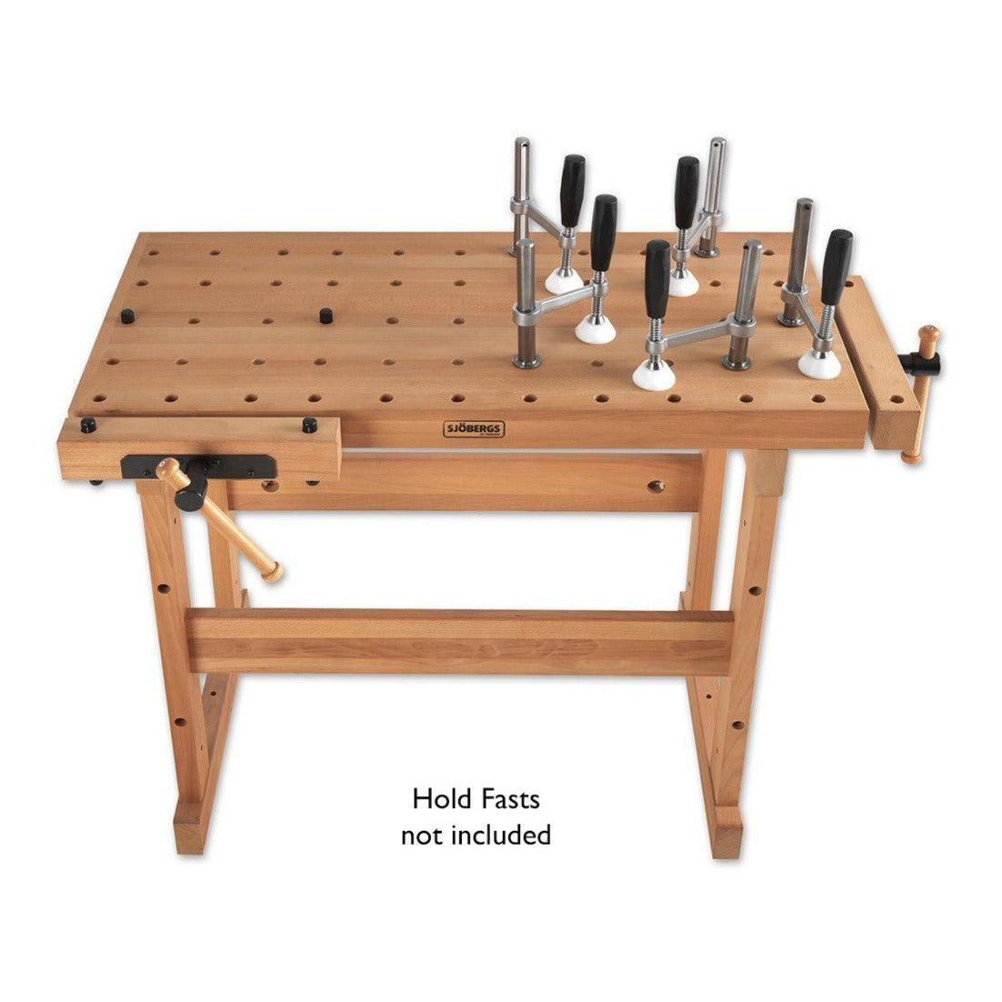 picture showing the Sjoberg multi hole work bench with 4 holdfasts placed around the bench. The holdfasts are not included in the price