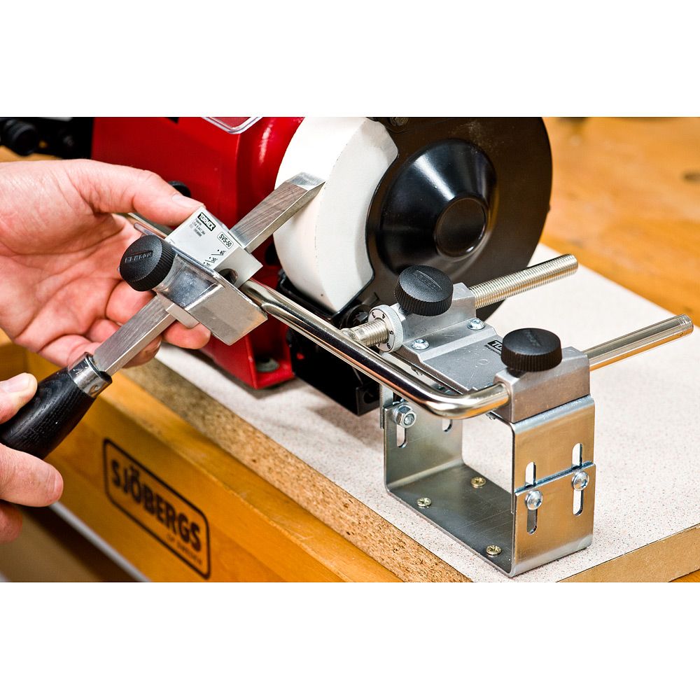image of a pairing chisel being sharpened using the Tormek BGM-100 Bench Grinder Mounting Set