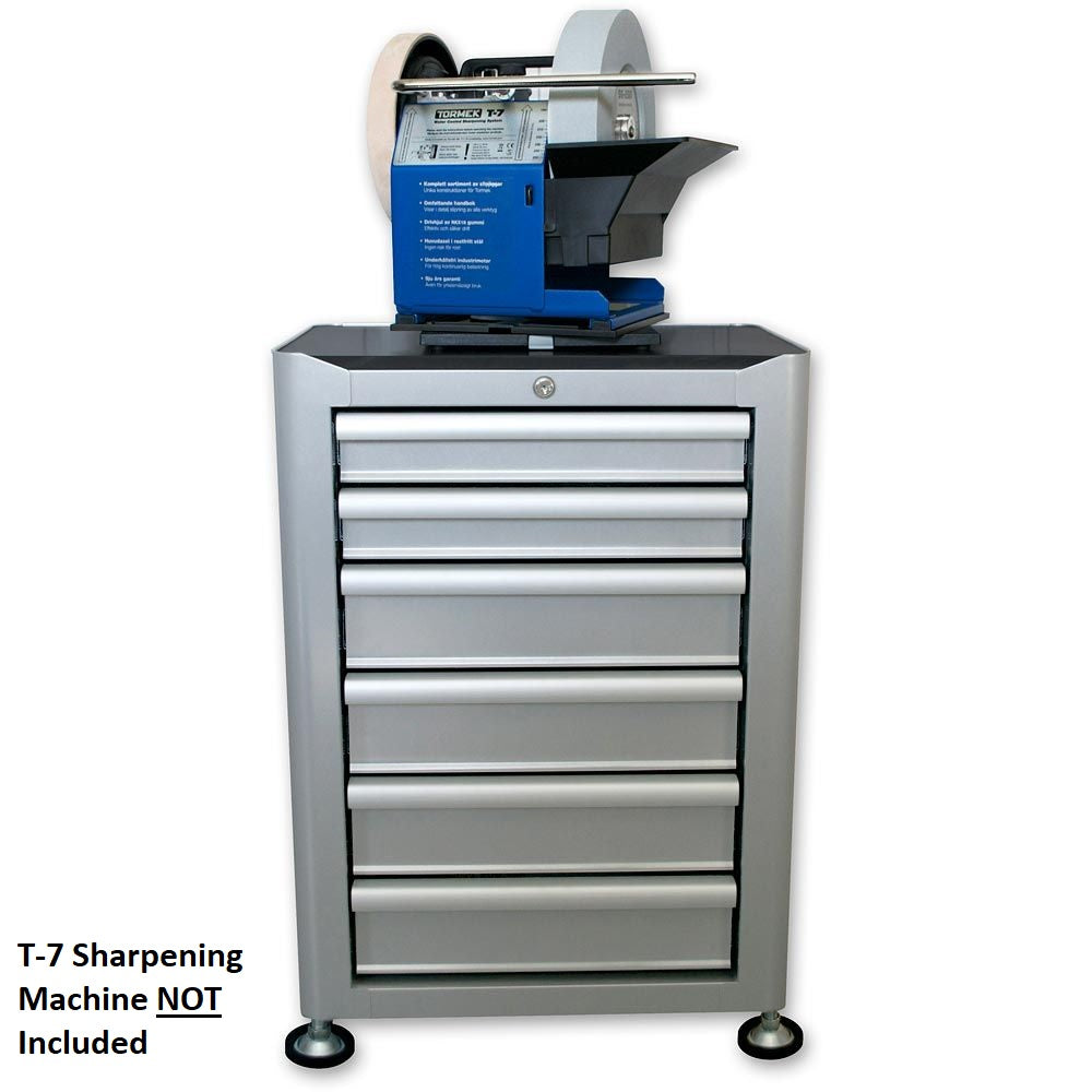 image of the Tormek TS-740 sharpening station with height adjustable feet. 6 Drawers with lock at the top. Picture shows a T-7 on the station to showing proportions. T-7 not included in sale.