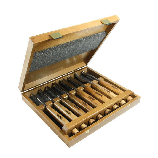 Narex Profi 8 piece Carving Set NAR-868000 long cone shaped beach handles of this high end spec set of curving shaped chisels. beautifully made wooden storage case where handles fit snuggly in one end and cut out wooden brace holds chisel shafts in place and held in place with foam inserted in the lid.  