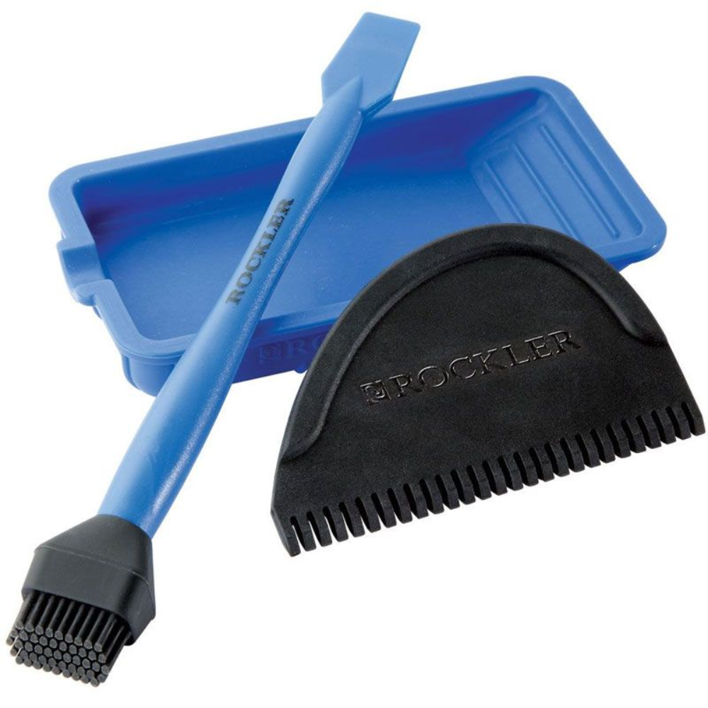 Rockler 3-Piece Silicone Glue Application Kit comprises of tray with cut out for brush handle to sit in. Combed spreader and silicone glue brush with rubber bristles and flat spatula spreader at the other end.