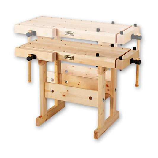 picture of the dual height Sjobergs Adult/Kids Workbench. Has a wooden vice at the end and one on the side.